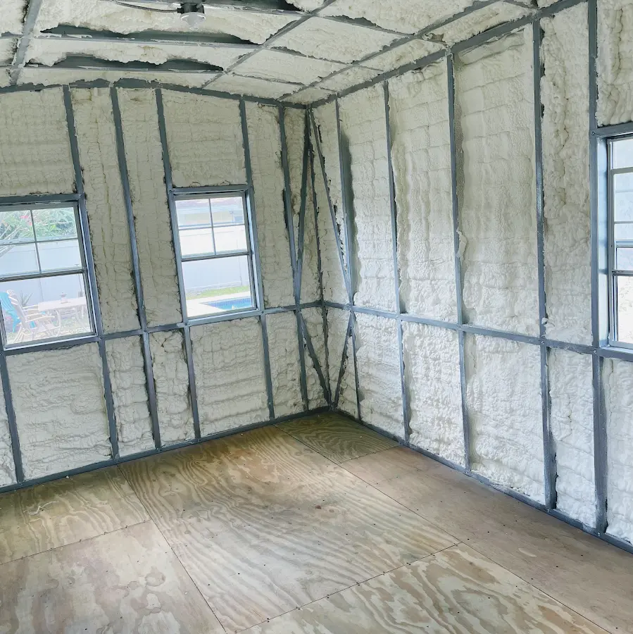 Closed-cell spray foam insulation applied to wall cavities in a residential project in Wellston